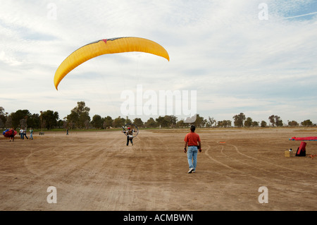 a powered paraglider pilot taking off at the 4th annual Arizona Flying Circus event in Casa Grande Arizona Stock Photo