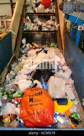 Plastic items collected and being baled by Wastesavers community recycling group from households in Newport South Wales Gwent UK Stock Photo