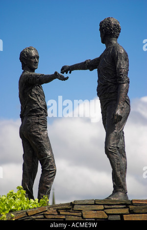 Hands across the divide statues Located on a roundabout west of Craigavon Bridge Derry Co Londonderry Northern Ireland Stock Photo