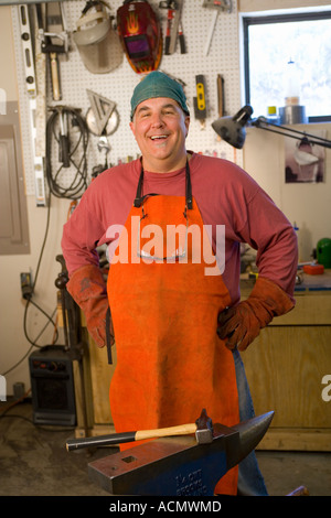metal fabricator,blacksmith in his studio Stock Photo