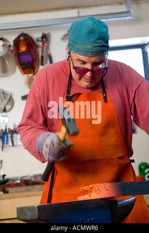 metal fabricator,blacksmith in his studio Stock Photo