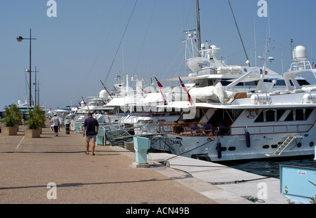 Cannes harbour on the French Riviera full of expensive boats owned by the rich and famous Stock Photo