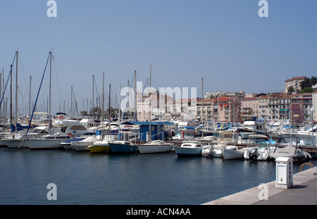 Cannes harbour on the French Riviera full of expensive boats owned by the rich and famous Stock Photo