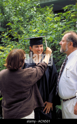 Female Grad with Parents Stock Photo
