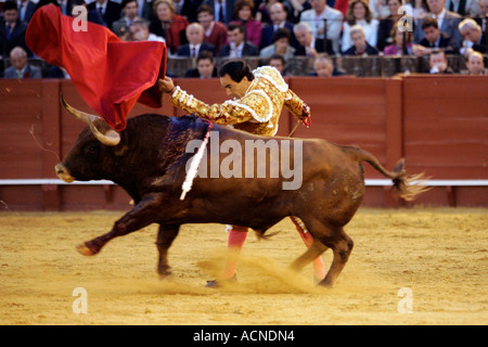 Manuel Jesus El Cid performing a natural or left hand bullfight Stock Photo