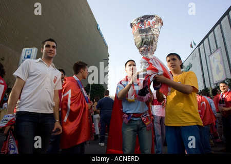 Young Sevilla FC fans with a homemade UEFA Cup replica Stock Photo