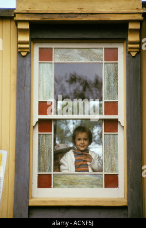 young girl at stained glass window frame Six Flags over Texas USA America South Stock Photo