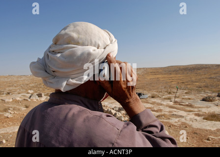 Palestinian man using mobile phone South Hebron hills, West Bank. Israel Stock Photo