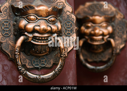 Ornate door handles on an old door in a Beijing hutong 2007 Stock Photo