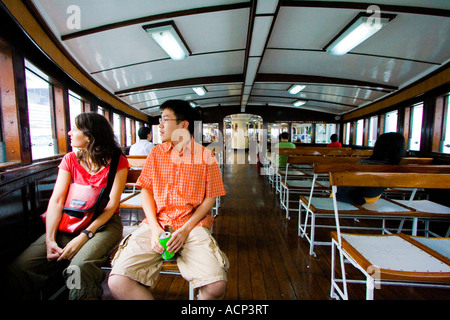Mixed Race Couple Tourists Ride the Star Ferry Hong Kong Stock Photo