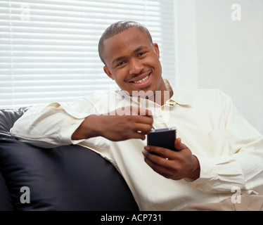African American student using a hand held computer. Stock Photo