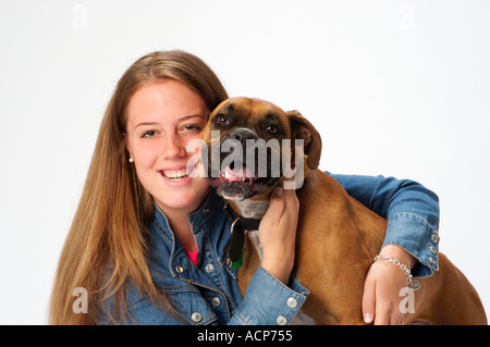 Portrait of teenage girl with her pet boxer dog Stock Photo