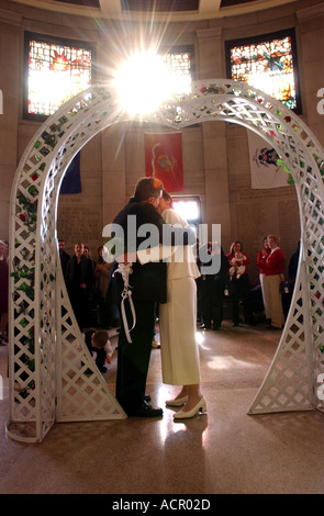 wedding Newlywed couple kiss after marriage on wedding day Stock Photo