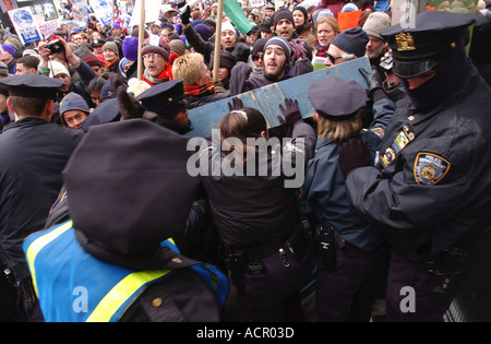 Riot People battle with police as they storm the police line during an Iraq war protest in New York City Stock Photo