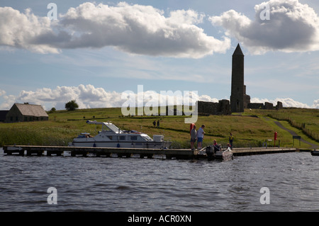 public jetty on Devenish Island with round tower visible as seen from lough erne Stock Photo