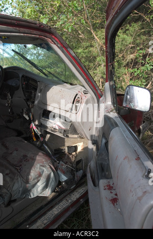 Vehicle involved in fatality traffic accident Blood splatter and smears on vehicle ceiling dashboard door panels and airbag Stock Photo