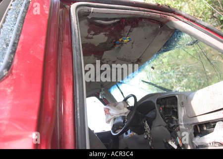 Vehicle involved in fatality traffic accident Blood splatter and smears on vehicle ceiling dashboard door panels and airbag Stock Photo