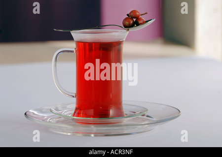 Rose hip tea in glass Stock Photo