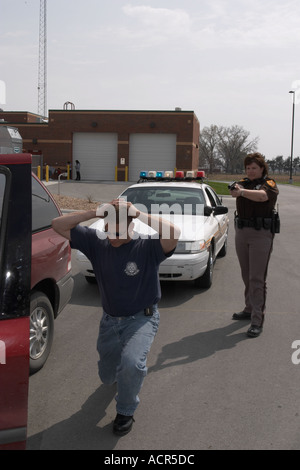 Felony traffic stop. Female deputy sheriff stopping motorist Stock ...