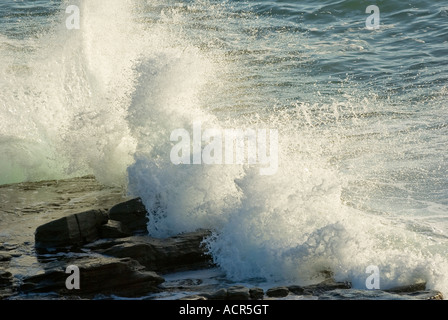 waves coming in and crashing on rocks Stock Photo