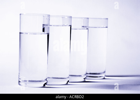 glass of water h2o drink clear fluid shadow health consume sprit vodka gin alcohol alcholic Stock Photo