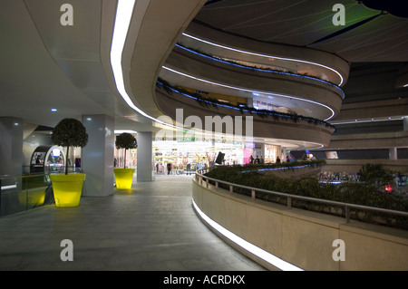 Night time at Kanyon, the futuristic shopping centre in Istanbul, Turkey. The curving shops and walkways have an strong organic Stock Photo