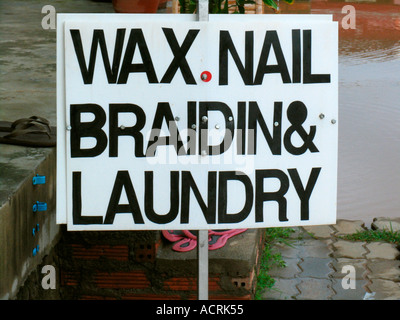 Beauty parlour and laundry sign Ko Pha Ngan island Thailand Stock Photo