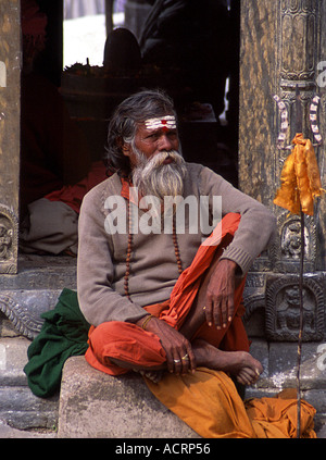 A sadhu warily eyes the camera at Pashupatinath during the festival of Shivaratri Nepal Stock Photo