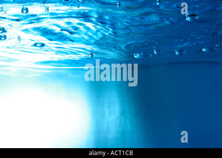 water surface seen from underwater with bubbles Stock Photo