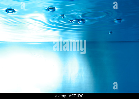 water surface seen from underwater with bubbles Stock Photo