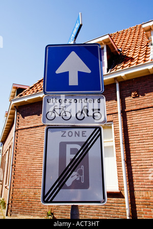 One way sign except for bicycles and scooters and end of parking zone sign The Netherlands Europe Stock Photo