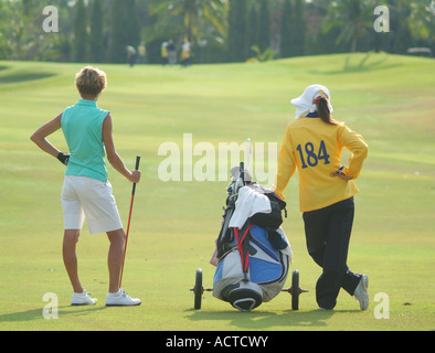 Golf player and caddie Stock Photo