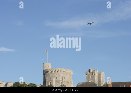 Home Again a plane flies over Windsor Castle Stock Photo