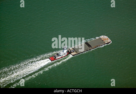 aerial view above tugboat pushing a barge in San Francisco bay Stock Photo