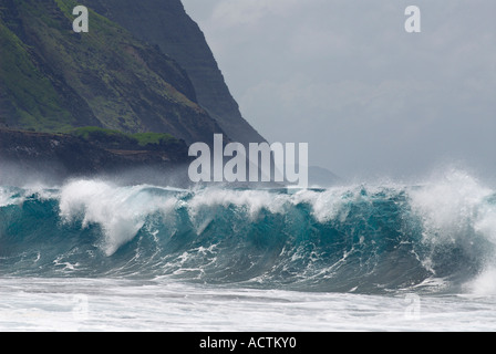 Blue wave breaking on Kalaupapa leper colony beach on Molokai Stock Photo