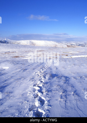 Footprints in snow on slopes of Corn Du Brecon Beacons Powys Wales UK