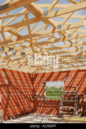 Wooden A frame roof truss construction on a small house Stock Photo