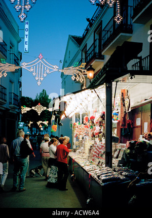 Fiesta time in the south of Spain and the decorative lights are up and street vendors are doing a roaring trade, Nerja, Malaga Stock Photo