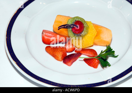 Fresh fruit plate appetizer at the Rotterdam Restaurant on the Holland America cruise ship Zaandam Stock Photo