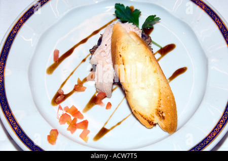 Cheese toast and thinly sliced pork appetizer on the Holland America cruise ship Zaandam Stock Photo