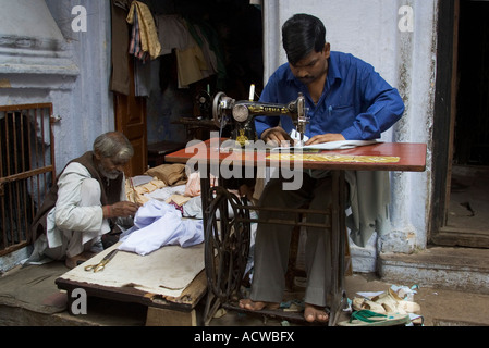 Tailor working with his old sewing machine Varanasi Benares India Stock Photo