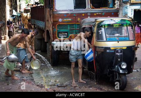 Cars and a rickshaw on the street, Calcutta, West Bengal, India Stock ...