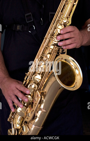 Saxophone brass details with player hands Stock Photo