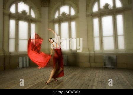 Dancer in a red dress in a Dance School hall Buenos Aires Stock Photo