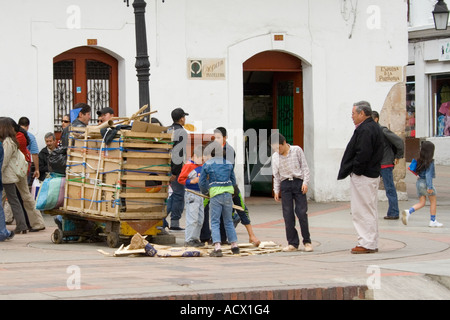 A family taking millboard  and paper in order to sell them as recycling Stock Photo