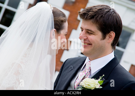 bride and groom looking at each other and smiling Stock Photo