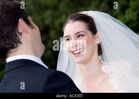 bride and groom looking into each others eyes Stock Photo
