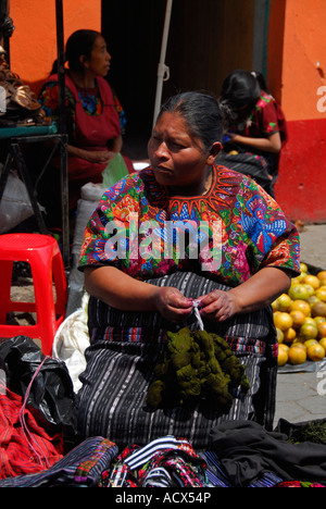 Indigenous woman selling textiles on the market in Chichicastenango, Guatemala, Central America Stock Photo