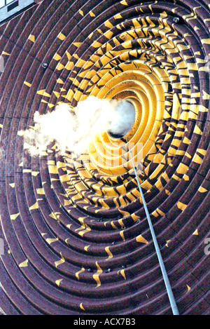 Backlit steam coming out of hole in billboard on building in New York City Stock Photo