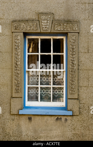 Traditional old wooden Sash window and decorated cement rendered surround Cardigan Abertifi Stock Photo